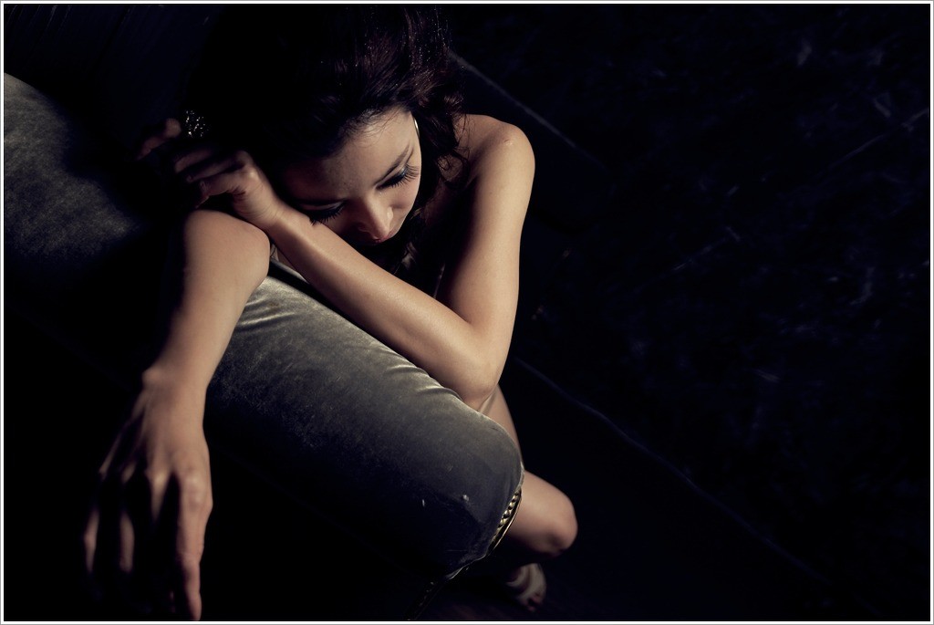 woman resting on couch