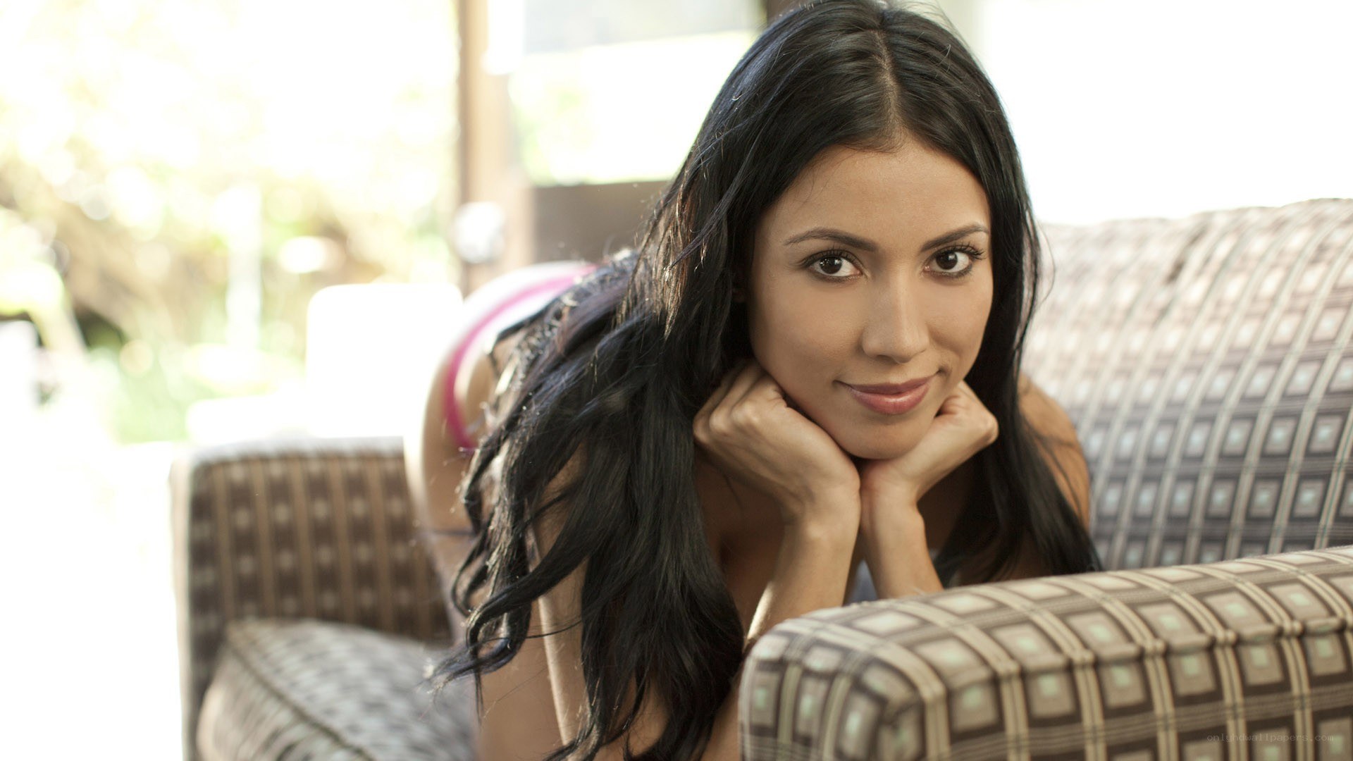 woman resting on couch