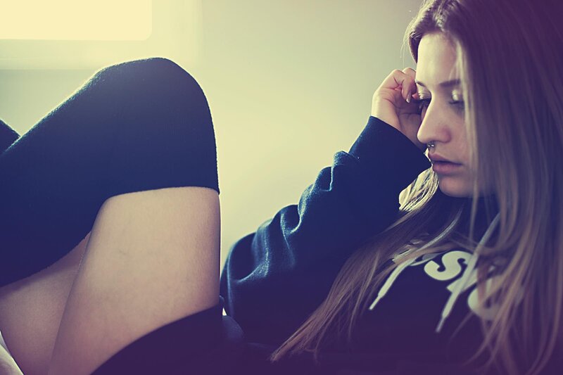 woman resting on couch