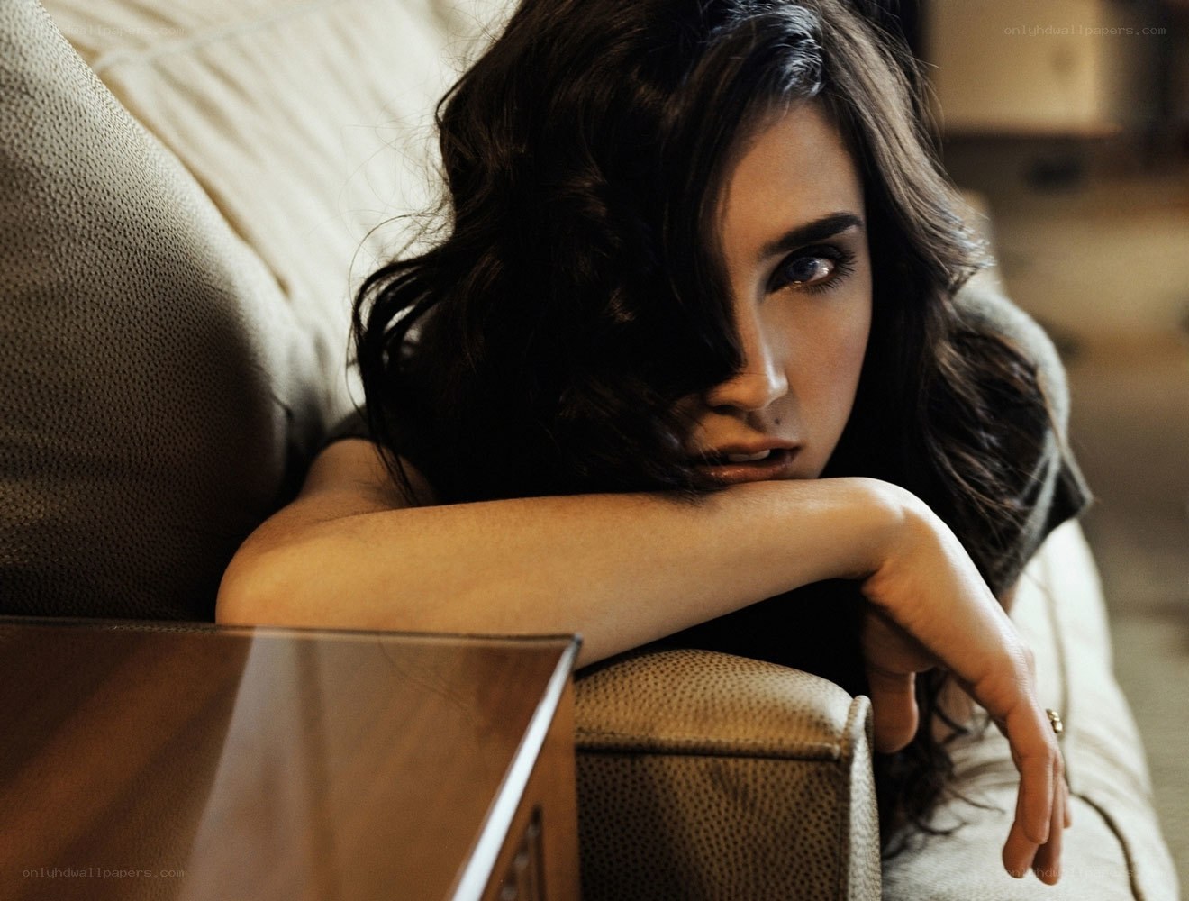 woman resting on couch