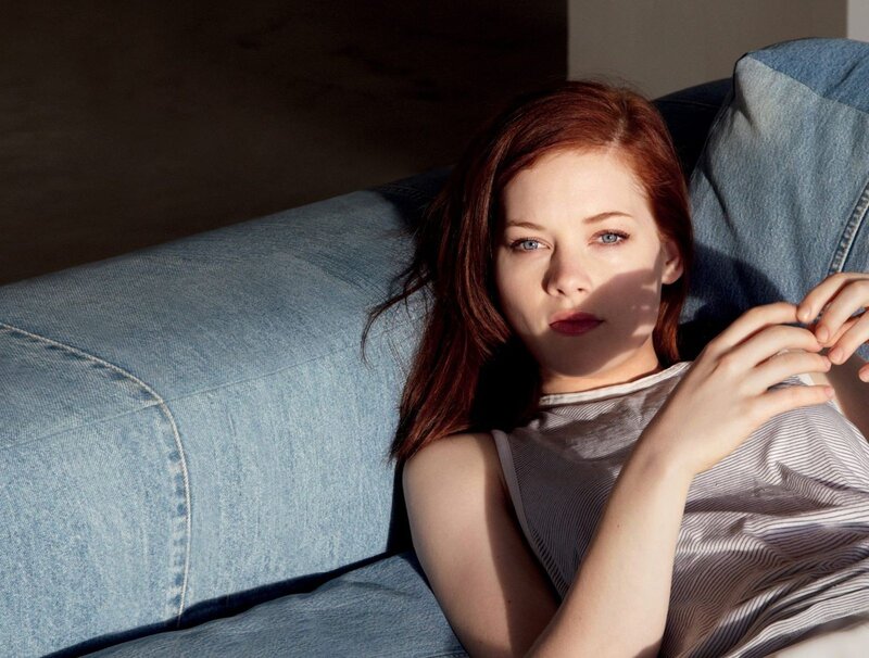 woman resting on denim couch