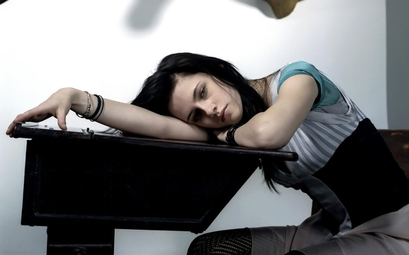 woman resting on desk