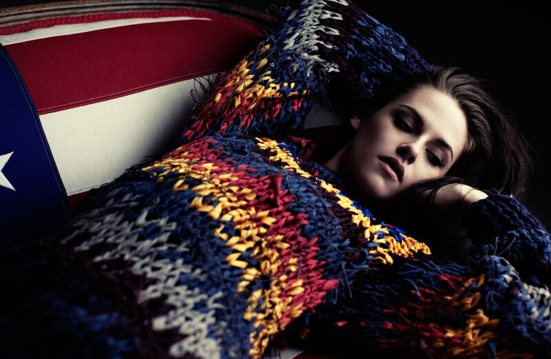 woman resting on flag-themed couch