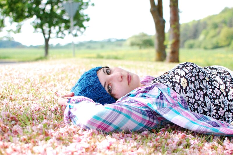 Woman resting on flower petals