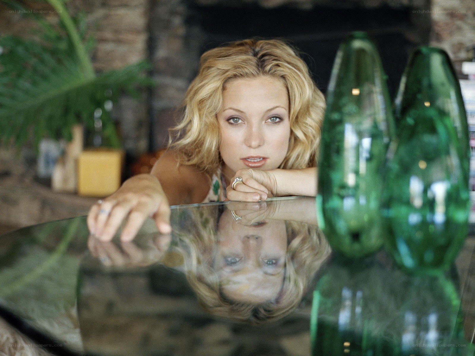 Woman resting on glass table