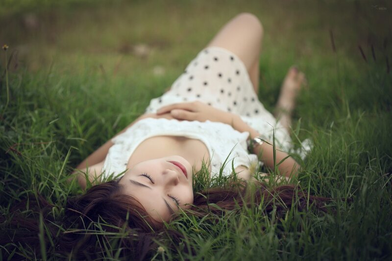 woman resting on grass