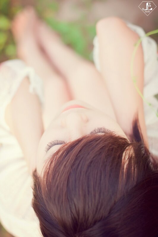 woman resting on grass