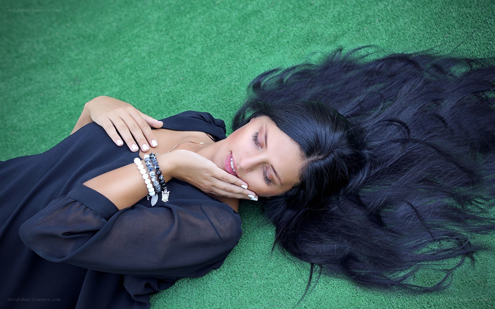 woman resting on grass