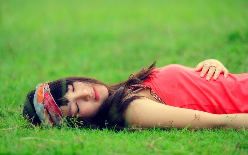 Woman resting on grass