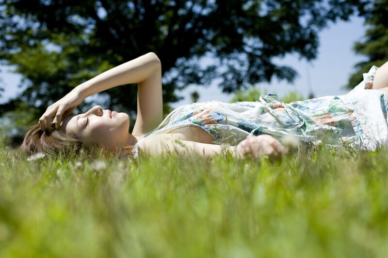 Woman resting on grass