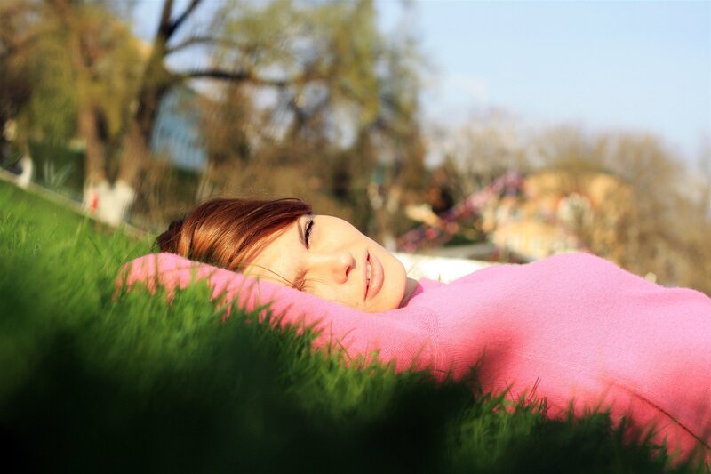 Woman resting on grass