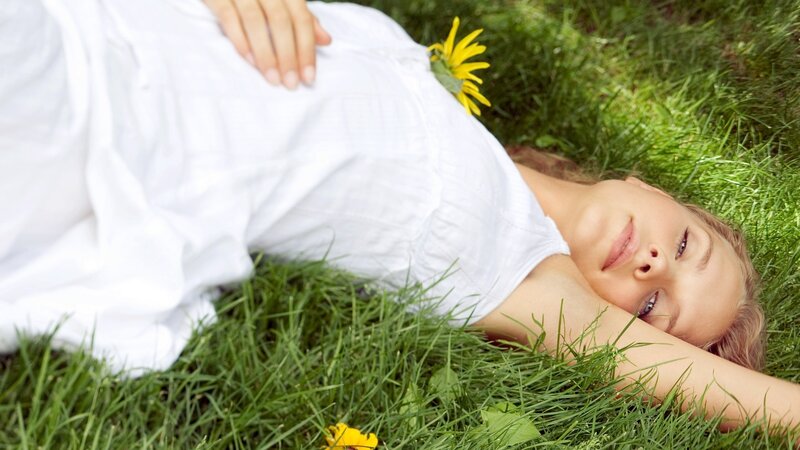 Woman resting on grass