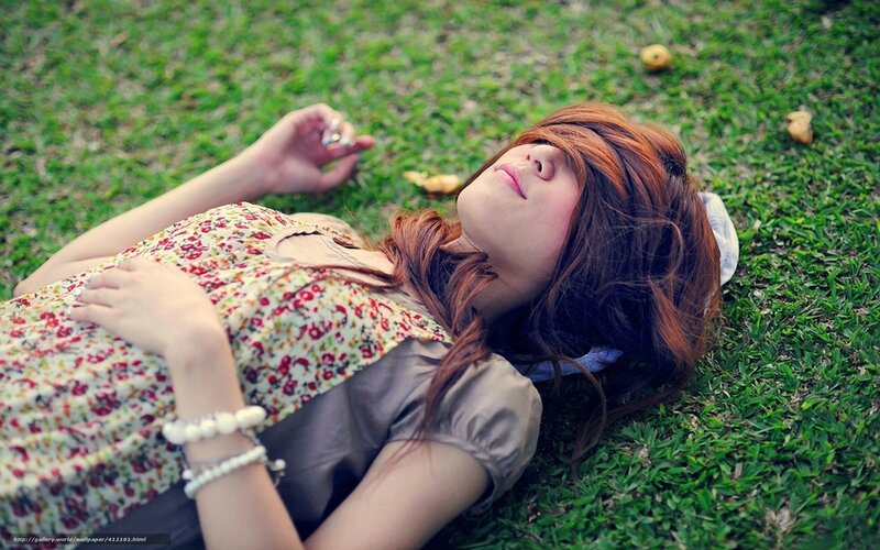 Woman resting on grass
