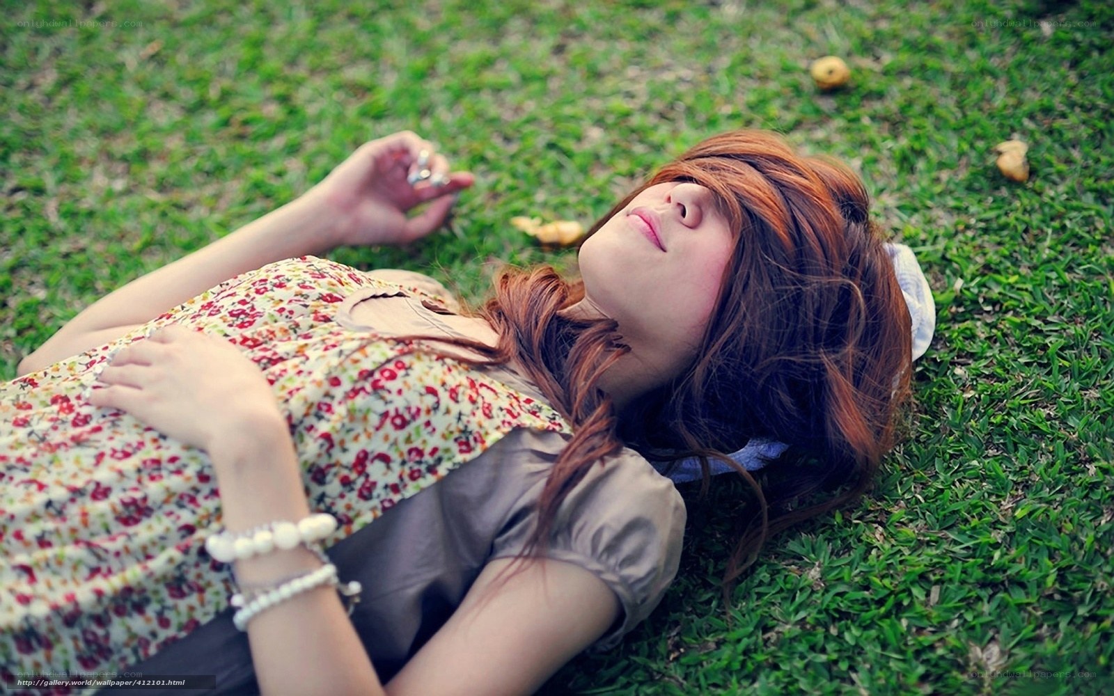 Woman resting on grass