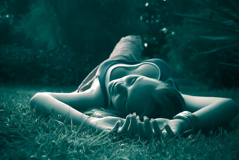 woman resting on grass