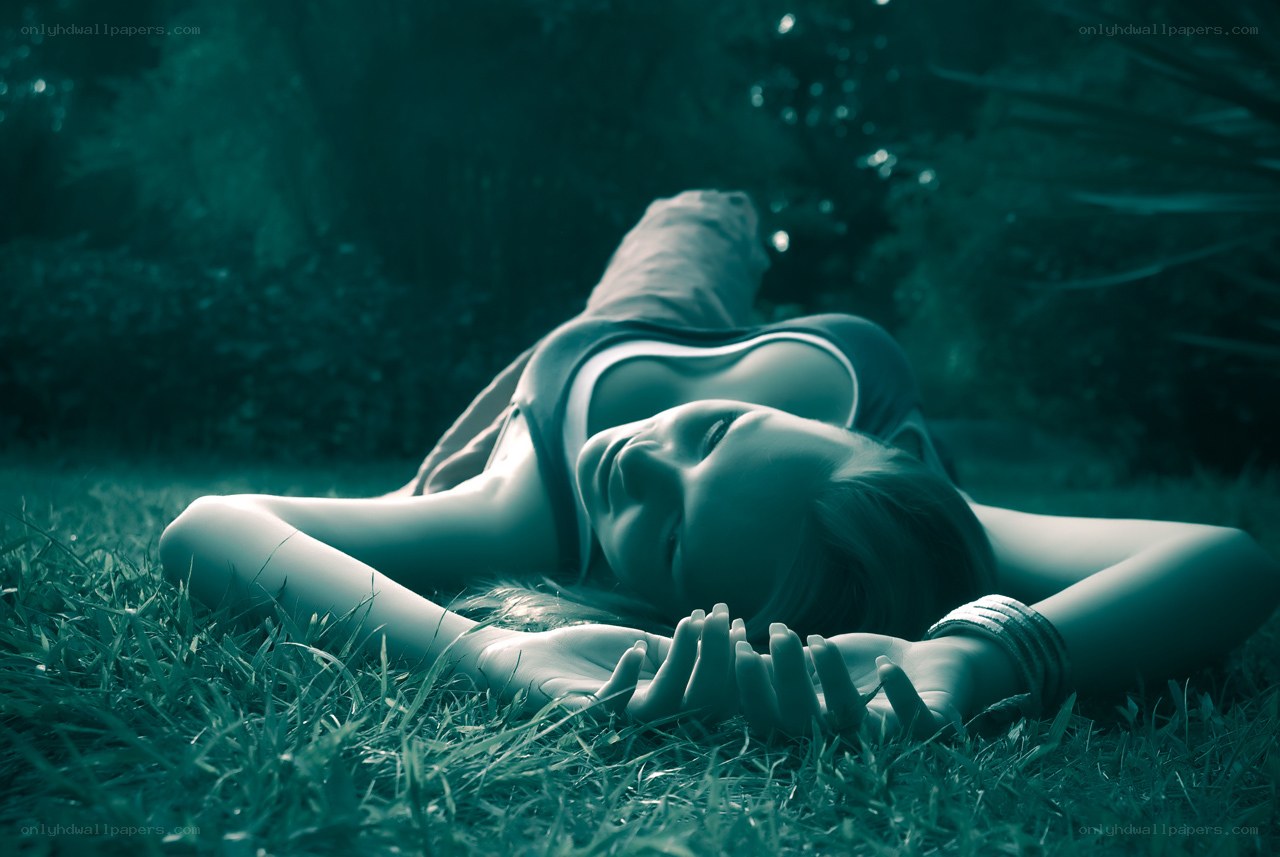 woman resting on grass