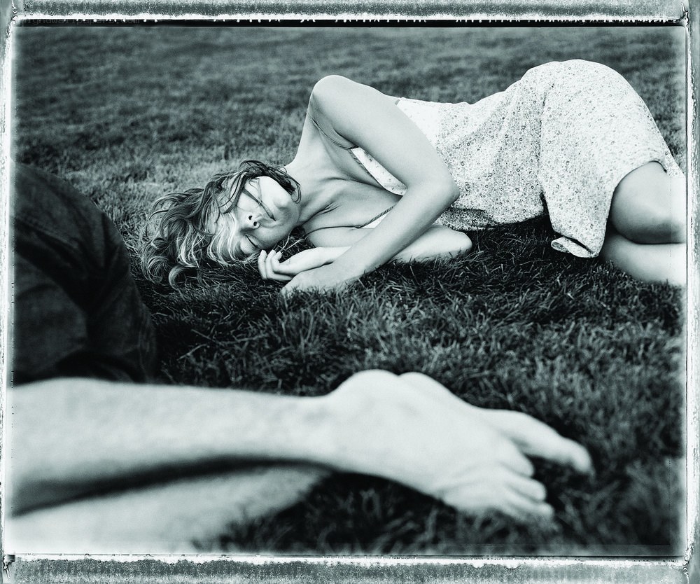 Woman resting on grass