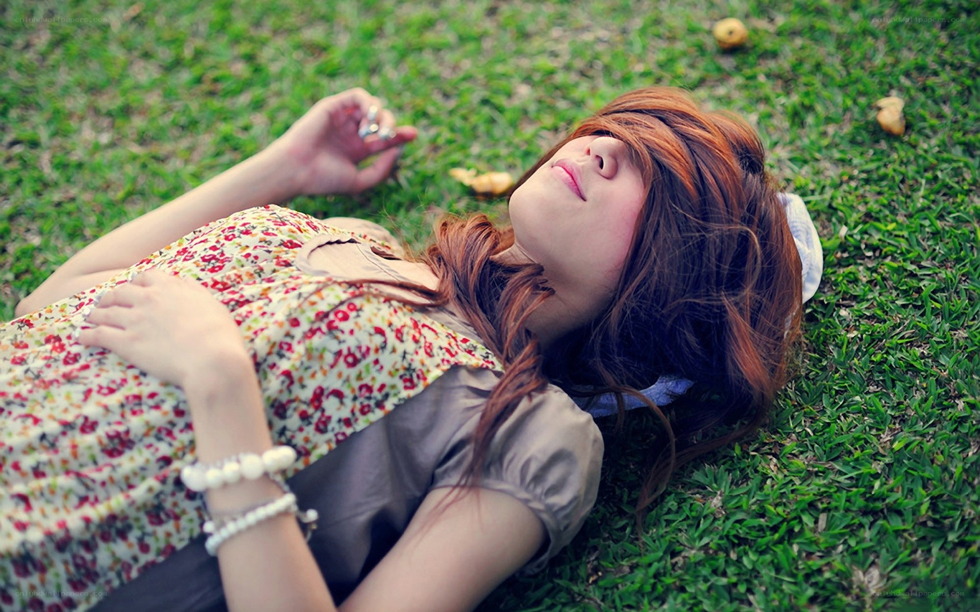 woman resting on grass
