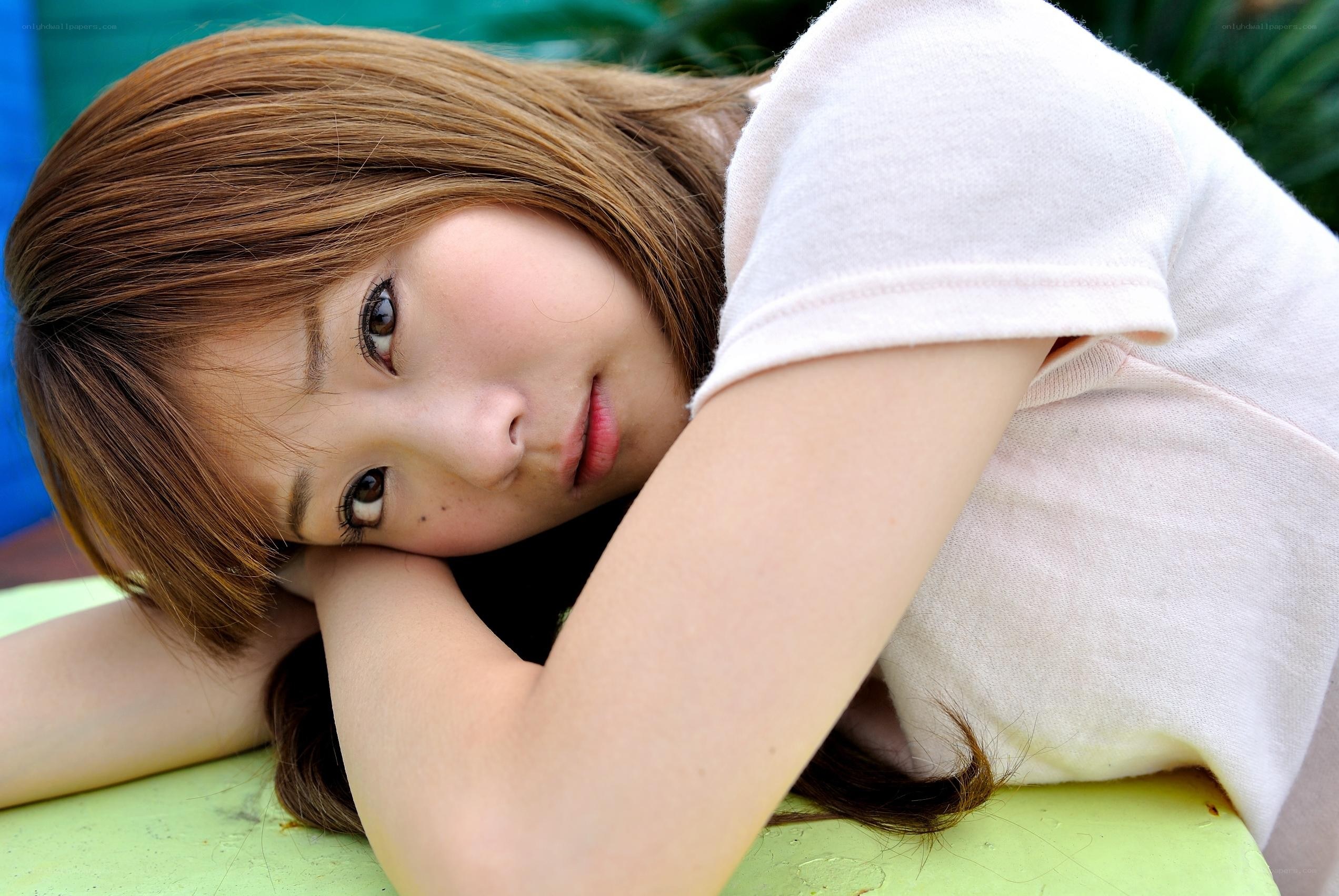 woman resting on green surface