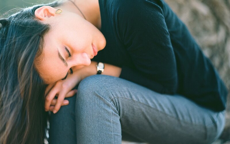 woman resting on knees