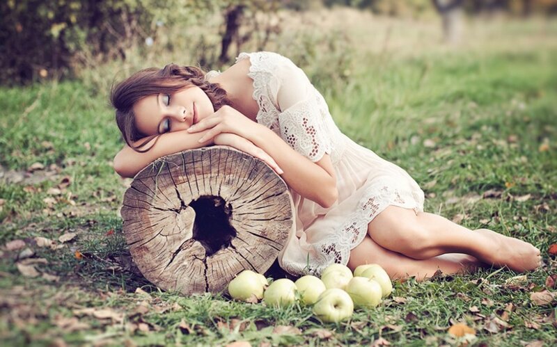 Woman Resting on Log — Green, Serene
