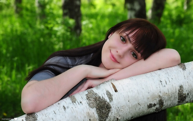 Woman Resting on Log — Green