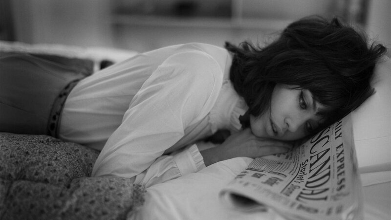 woman resting on newspaper