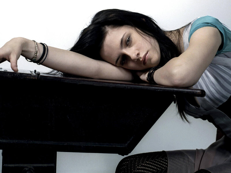 woman resting on piano
