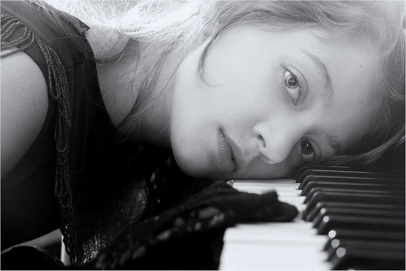 Woman Resting on Piano — Black, Contemplative, Photograph