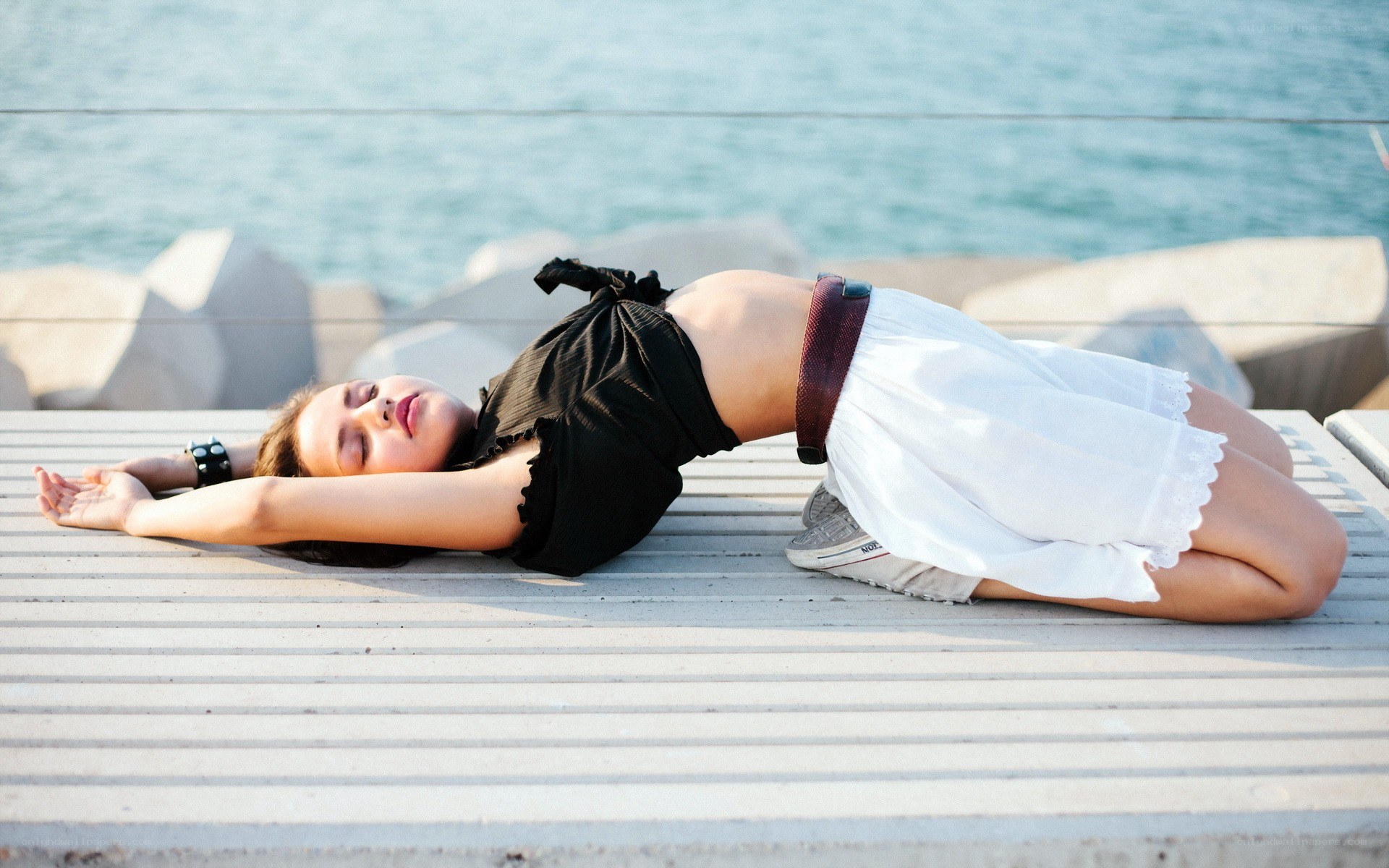 Woman resting on pier