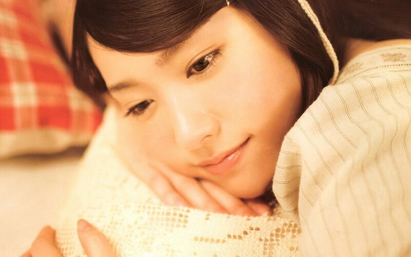 woman resting on pillow
