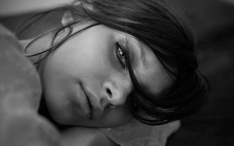 woman resting on pillow