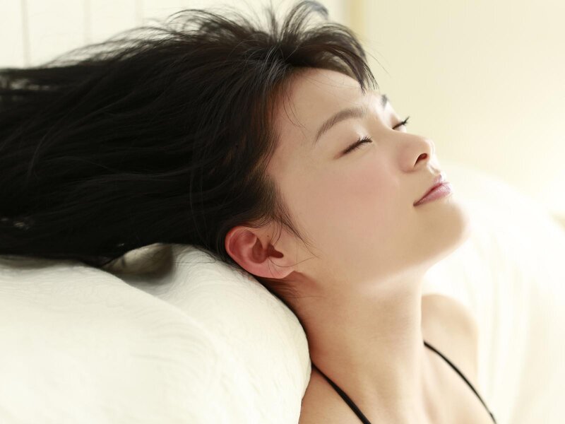 woman resting on pillow