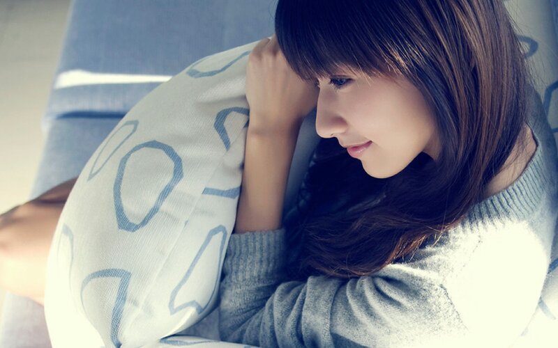 woman resting on pillow