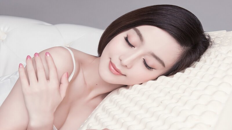 woman resting on pillow