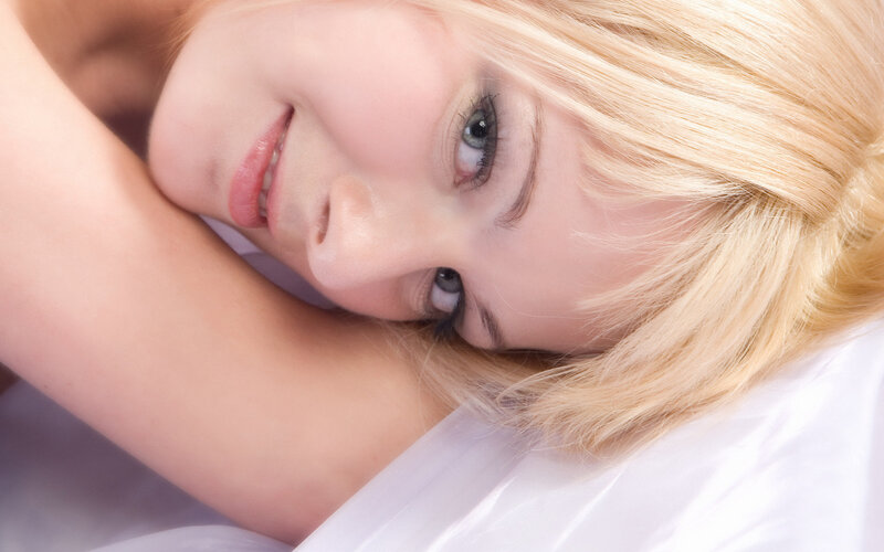 woman resting on pillow