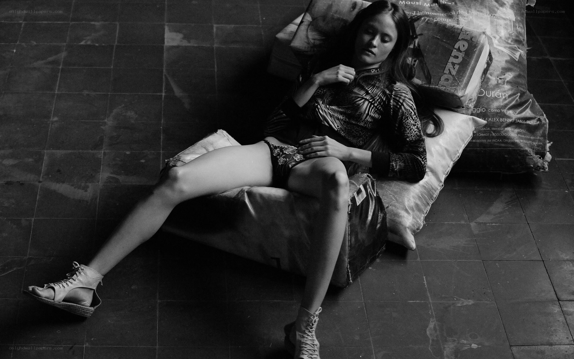 woman resting on pillows