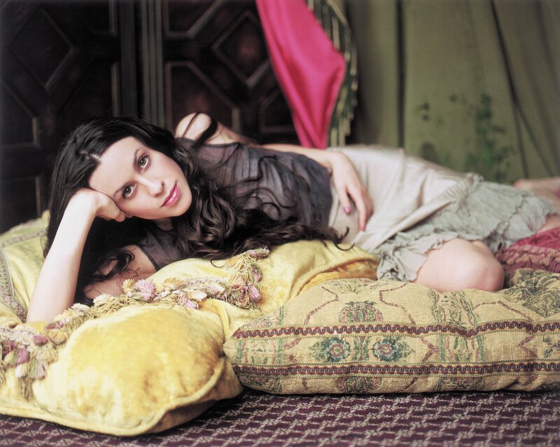 woman resting on pillows