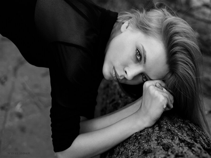 Woman Resting on Rock — Black
