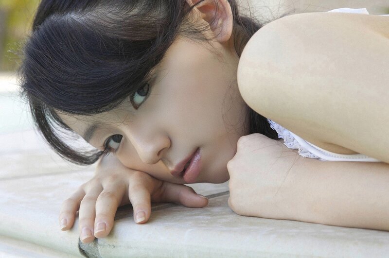 woman resting on stone