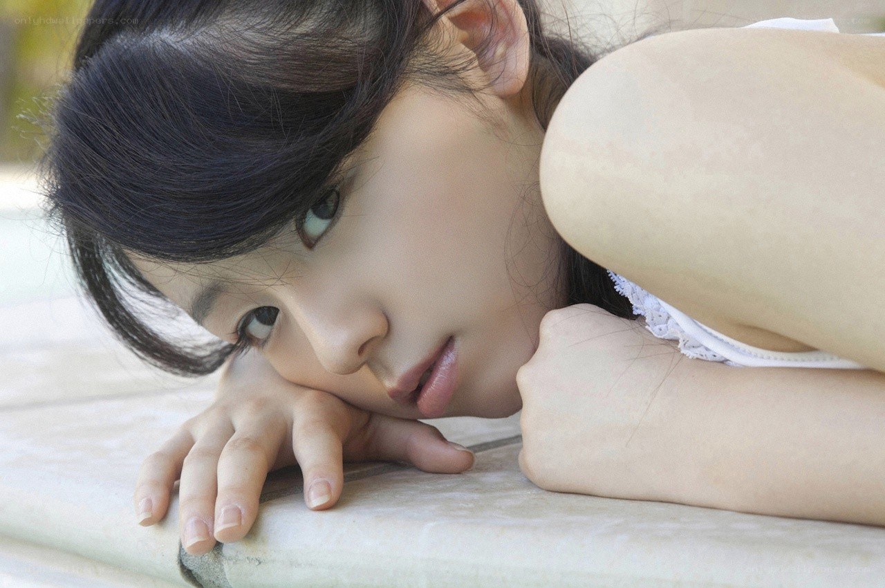 woman resting on stone