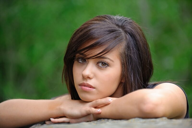 woman resting on stone