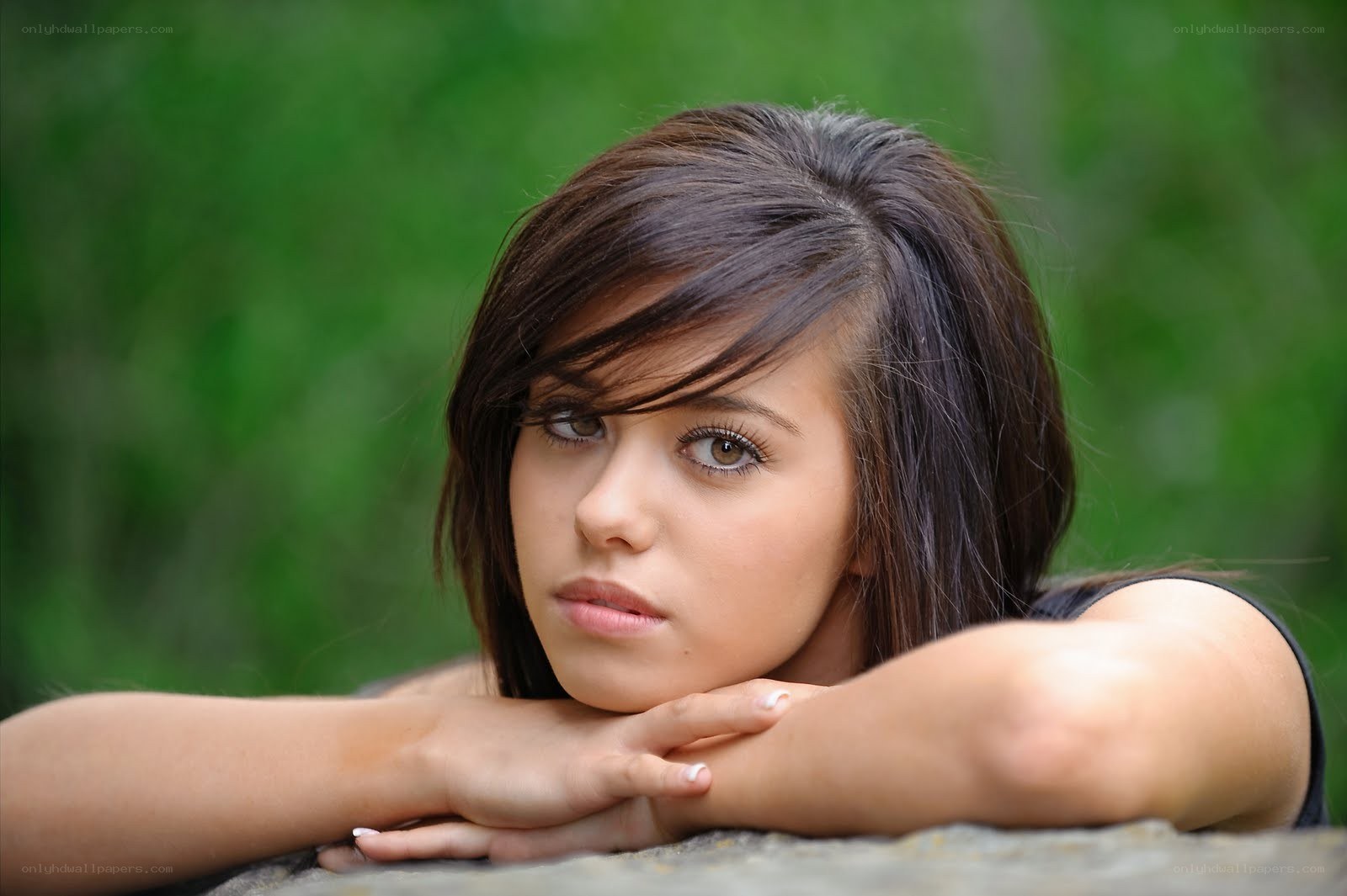 woman resting on stone
