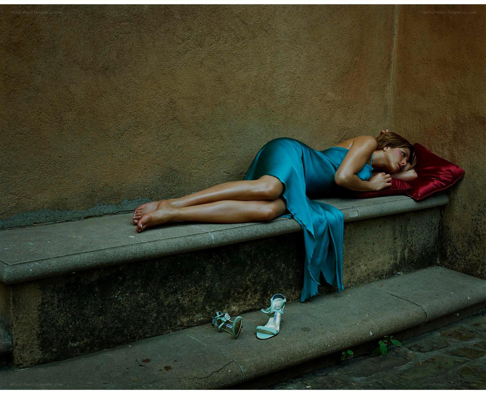 Woman resting on stone bench