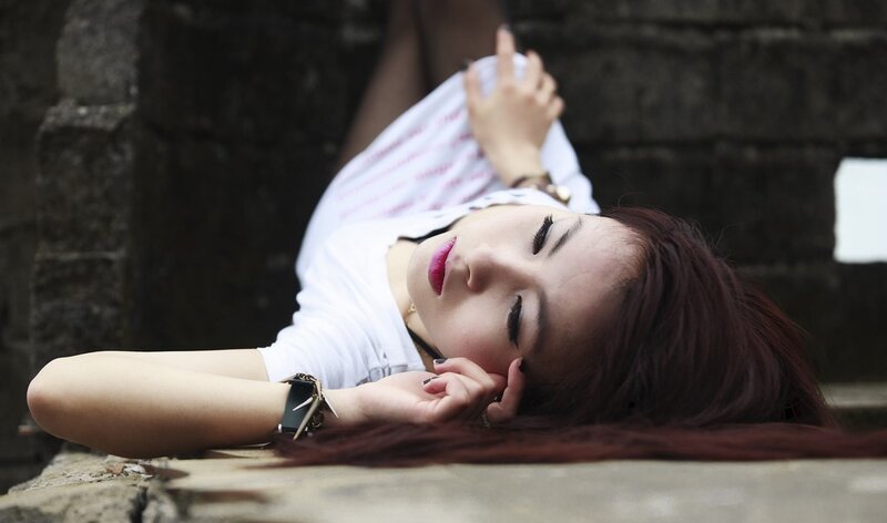 woman resting on stone steps