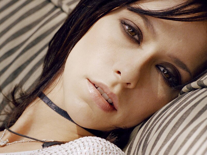 woman resting on striped pillow