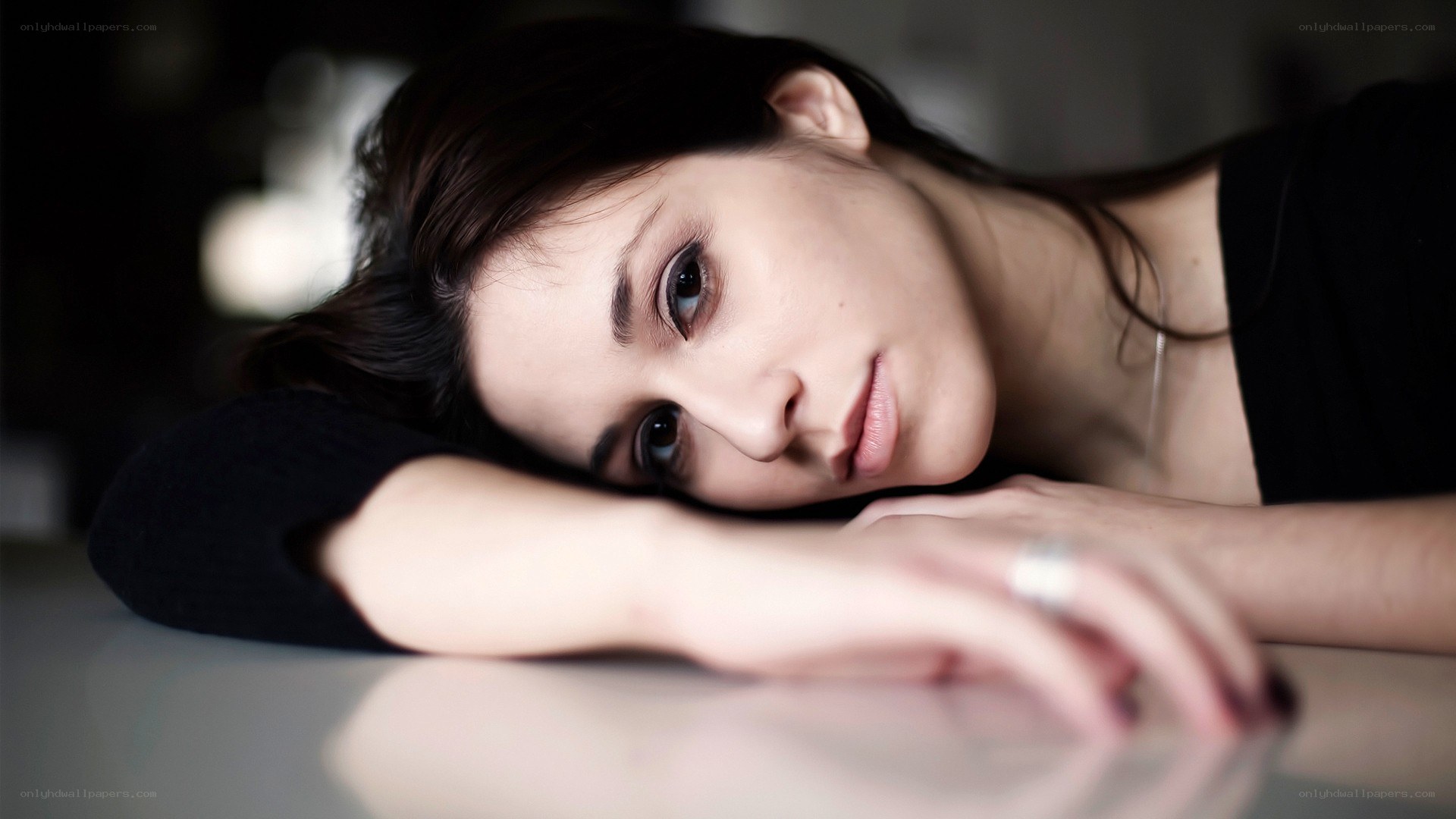woman resting on table