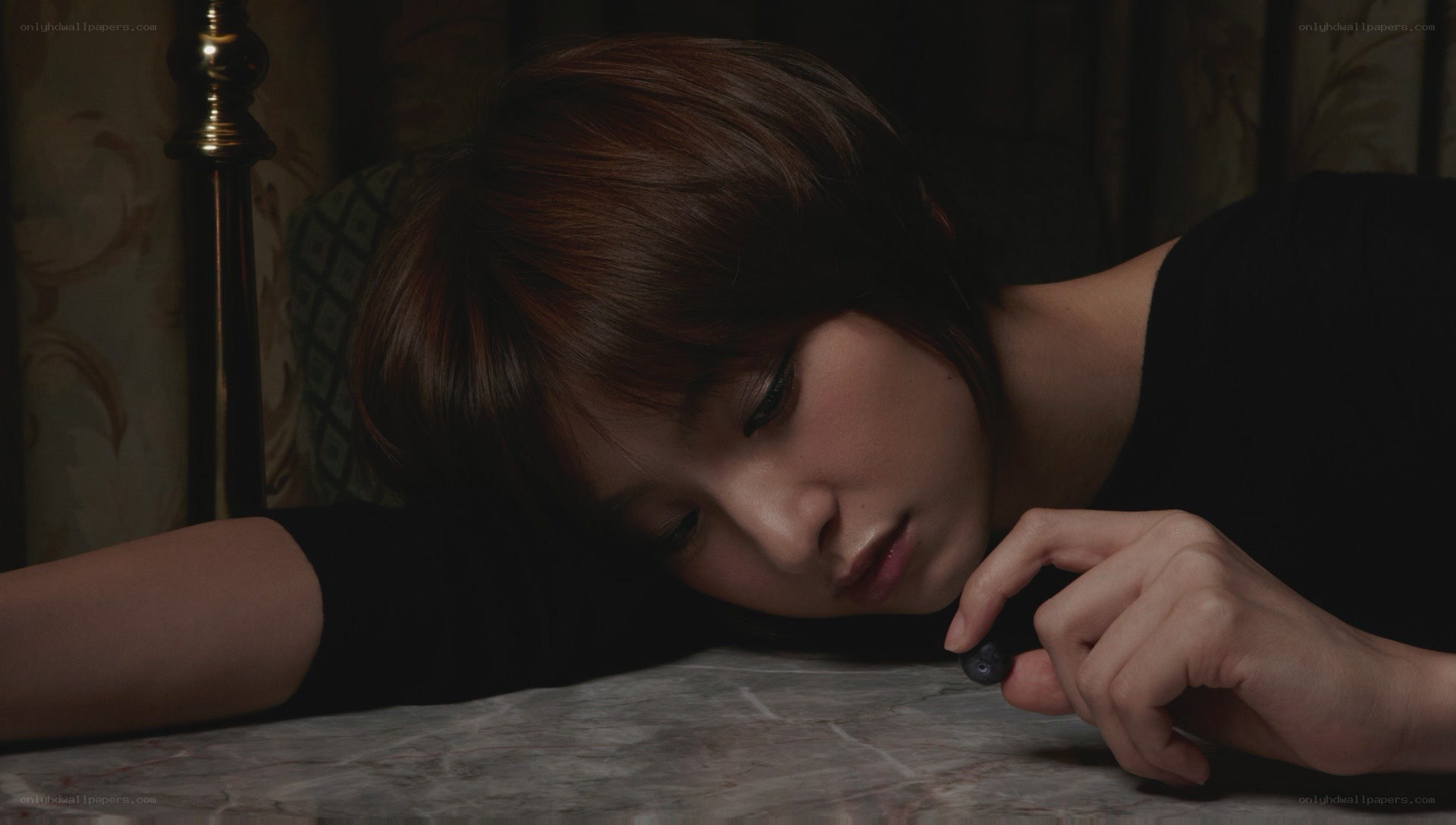 woman resting on table