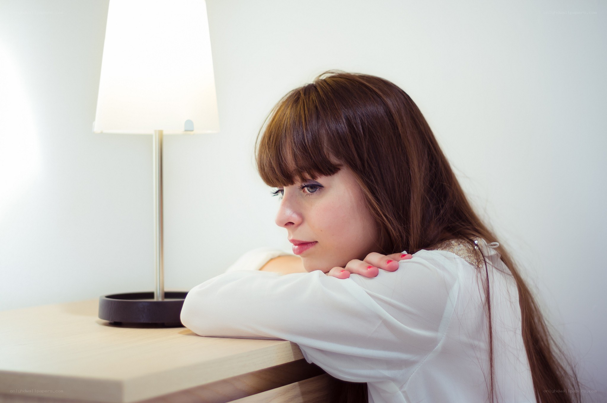 woman resting on table