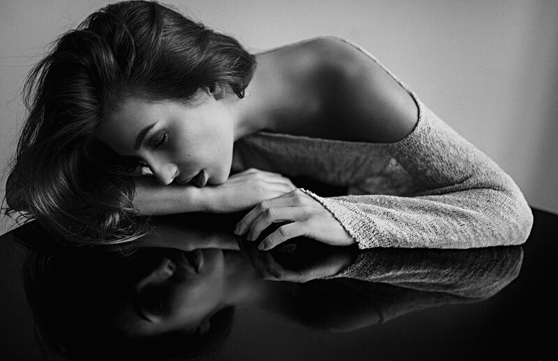 Woman Resting on Table — Black, Dramatic